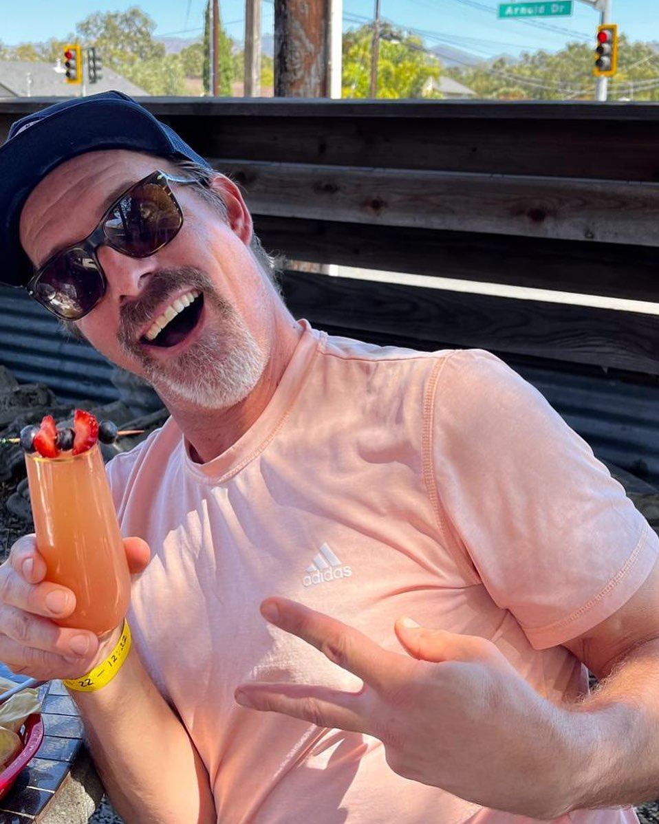 A guest enjoying a weekend brunch drink on the Picazo Café patio