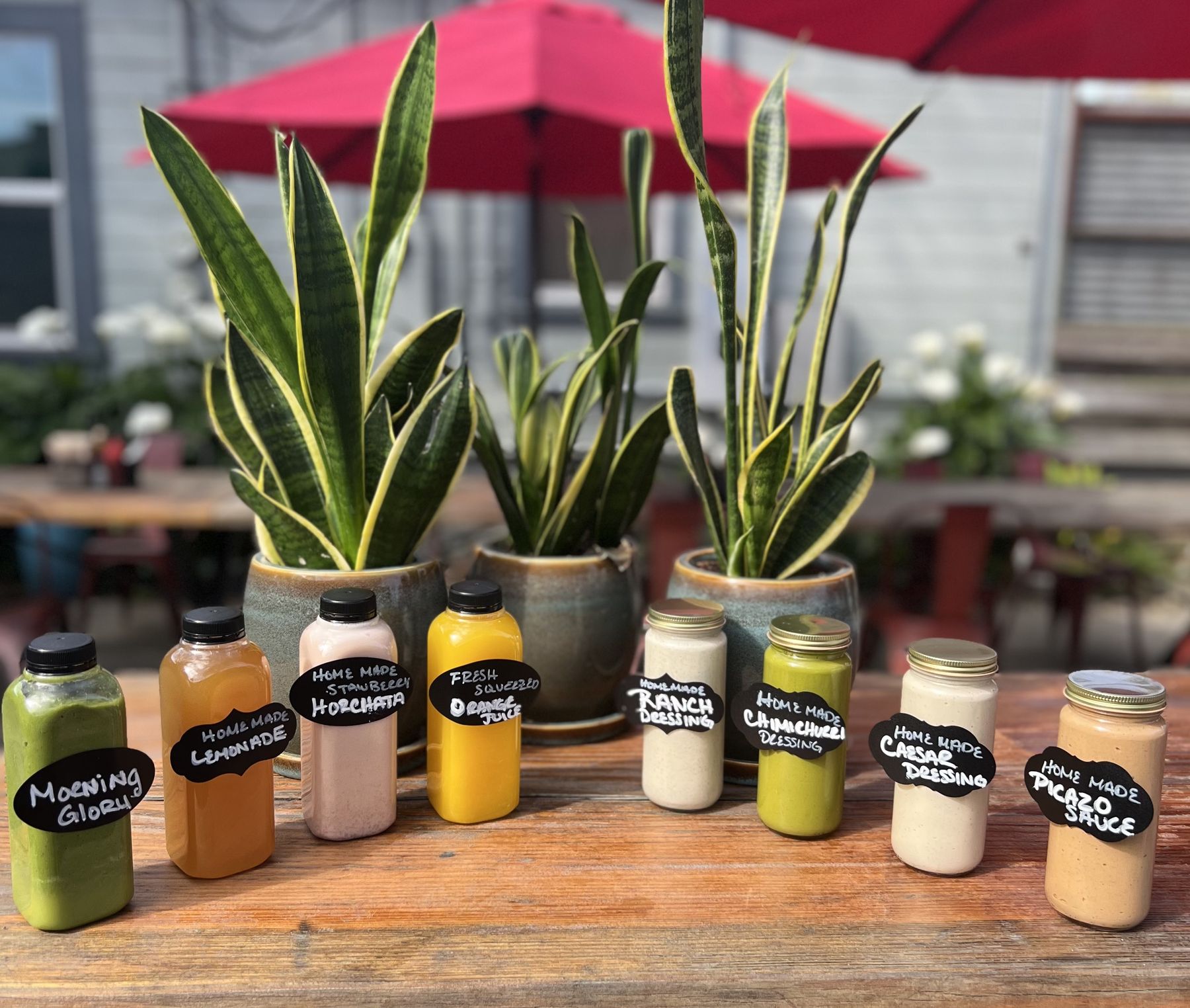 A shelf of Picazo Café house-made bottled dressings and sauces